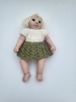 Baby doll with green skirt